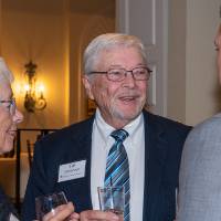 Cal DenBesten with two guests.